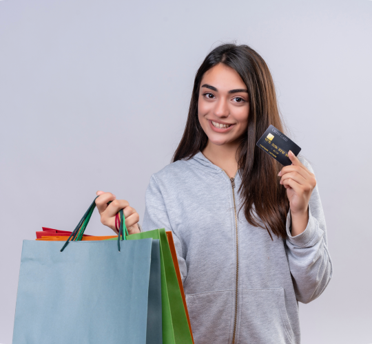 young-beautiful-girl-gray-hoody-looking-camera-with-smile-face-holding-packages-credit-standing-white-background
